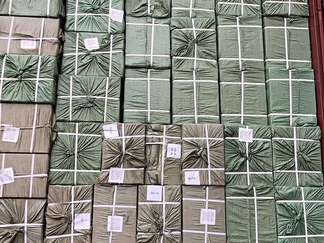 Container fully loaded with bales