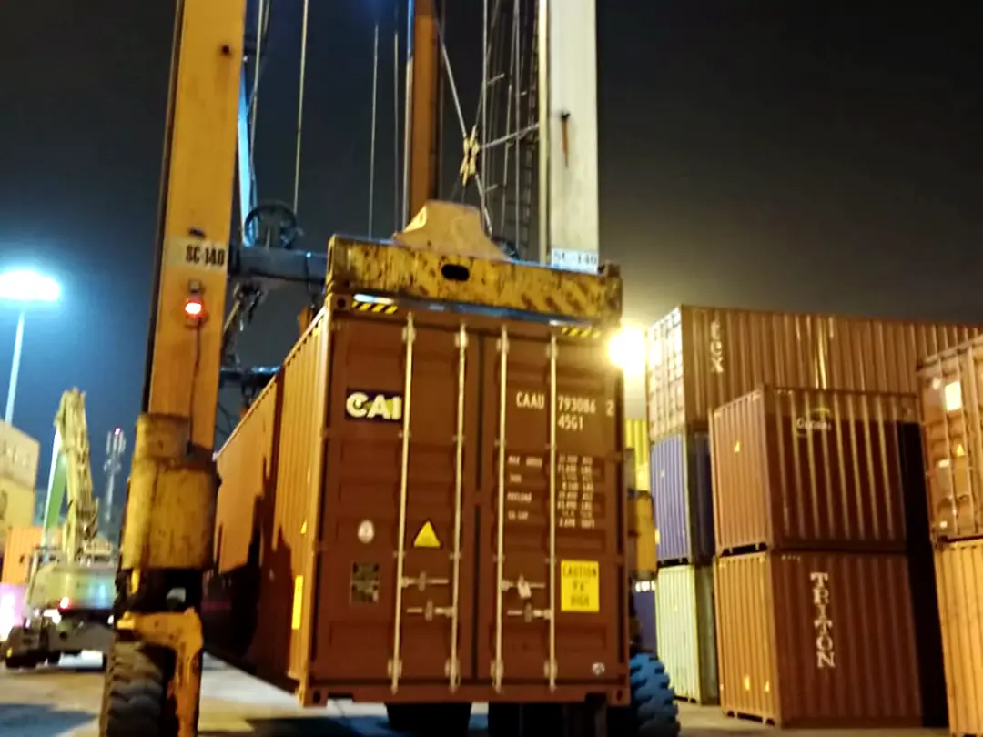 Reach stacker handling a container in the yard